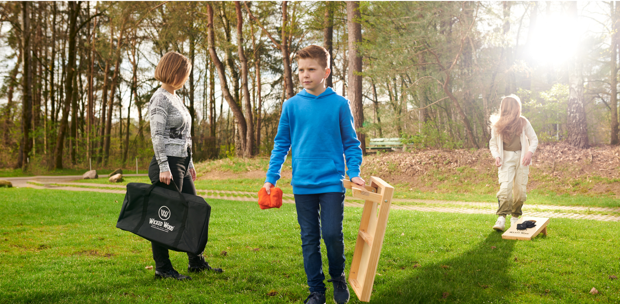 Family playing Cornhole